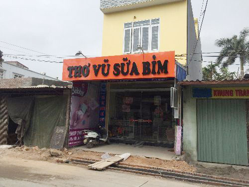 Biển cửa hàng sữa bỉm
